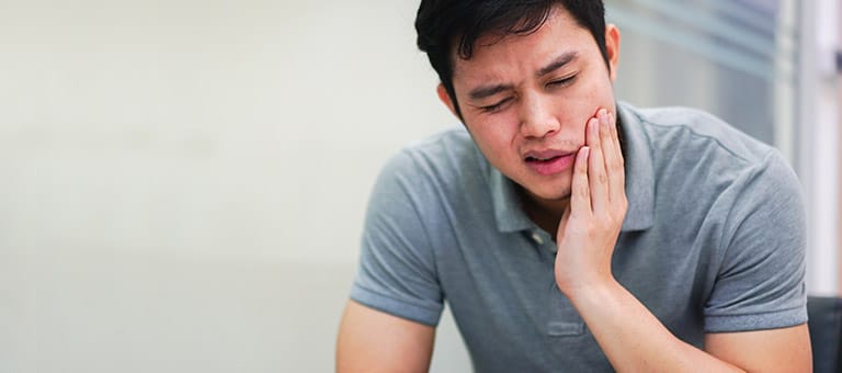 Man Experiencing Mouth Pain