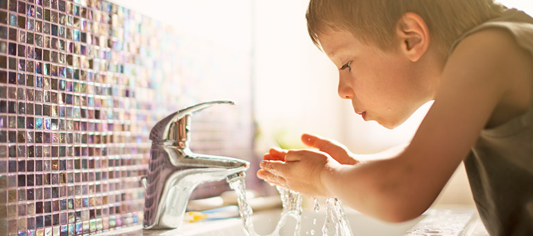Child Drinking Fluorinated Water