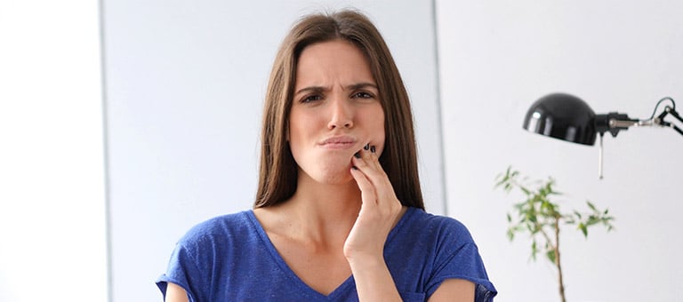 Woman with Painful Mouth