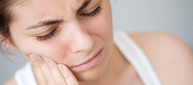 Woman Experiencing Tooth Sensitivity